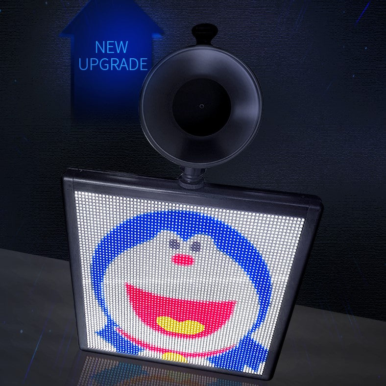 A vibrant square LED car display showcasing colorful emoticons and text, controlled via Bluetooth app.
